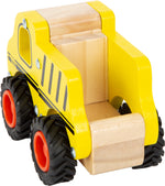 Yellow toy bulldozer with wooden blocks on a white background