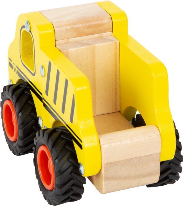 Yellow toy bulldozer with wooden blocks on a white background