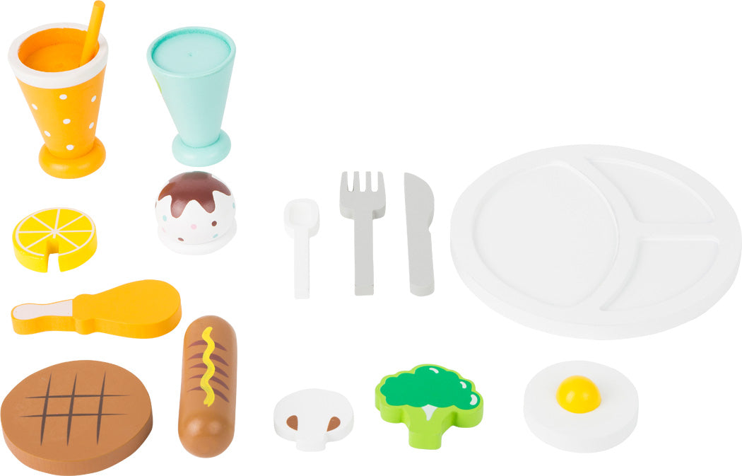 Allir íhlutir úr leikmáltíðasettinu lagðir upp á borð.