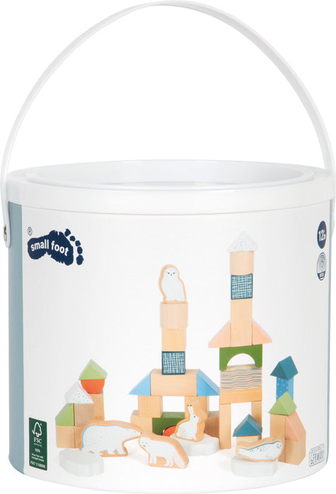 Hringlaga geymslubox með Arctic viðarkubbum og myndum af kubbunum á umbúðum.