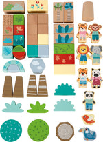 Collection of wooden toys including blocks, animal figures, and nature-themed pieces on a white background.