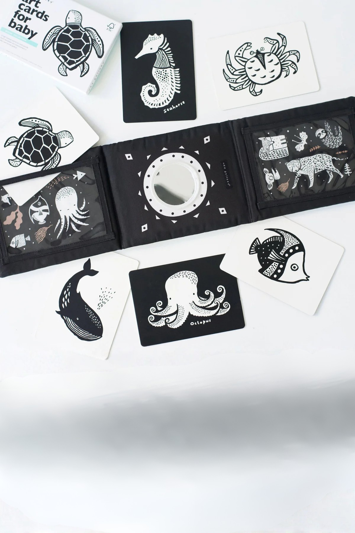 Black and white illustrated cards with animal designs on a white background