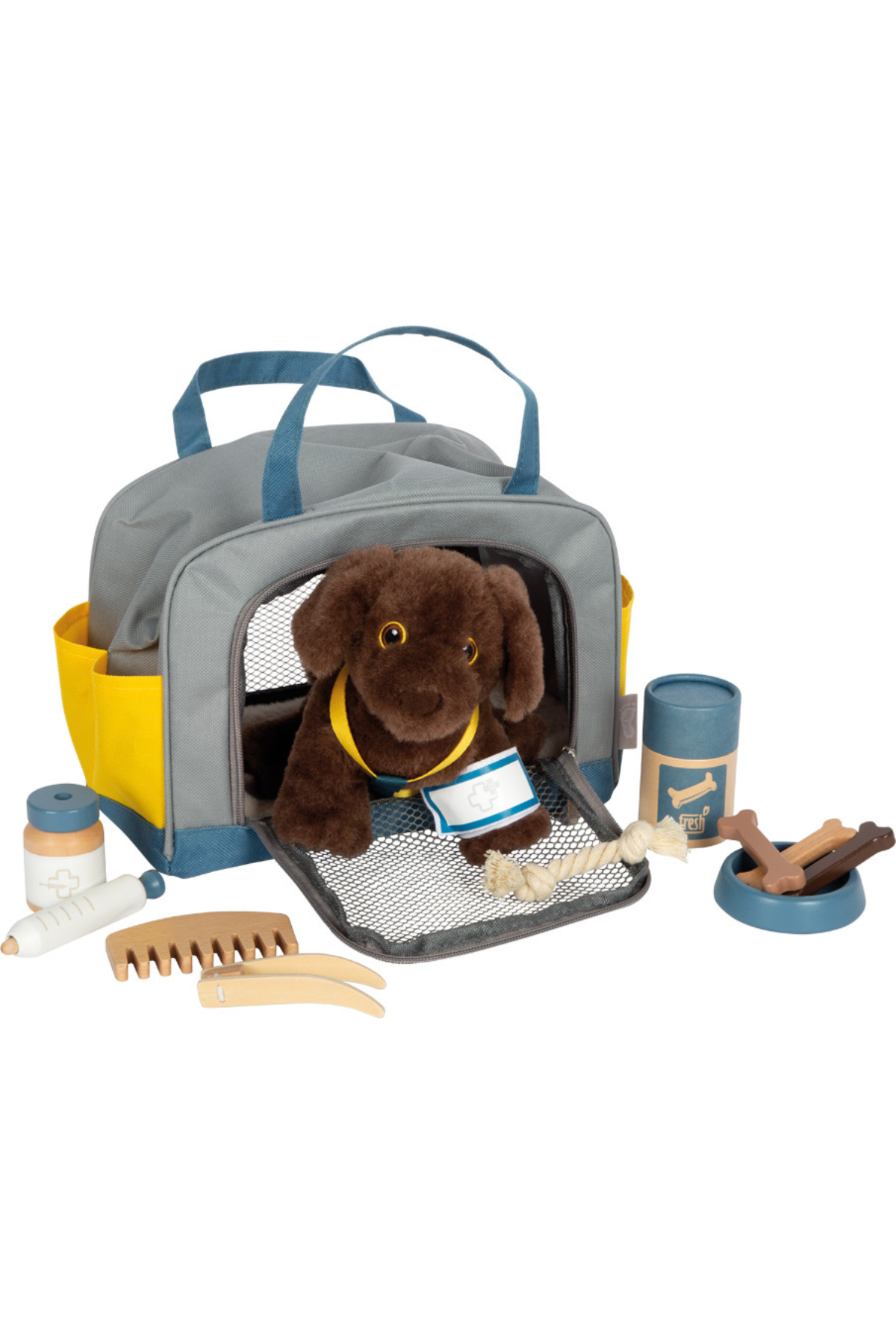 Brúnt mjúkdýr í ferðatösku með fylgihlutum eins og beini, sprautu og hárbursta