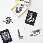 Set of black animal-themed stencils on a white surface