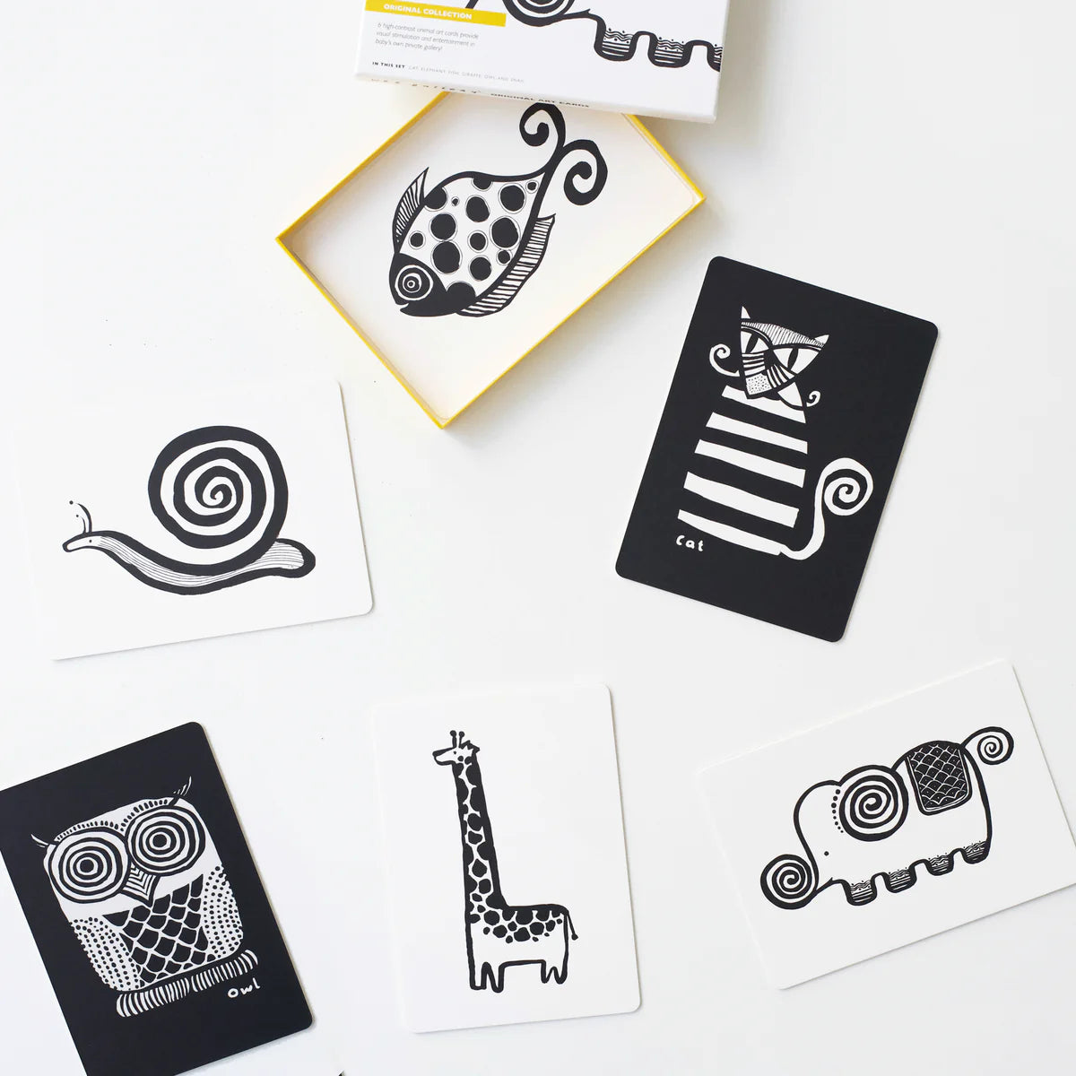 Set of black animal-themed stencils on a white surface