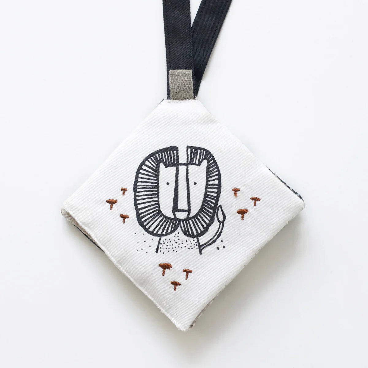 Small pouch with a lion face design on a white background