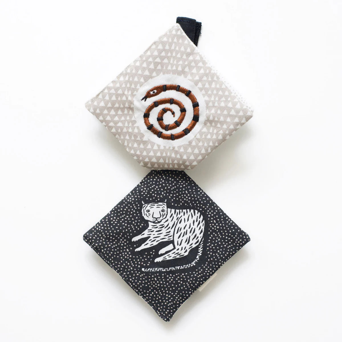 Two fabric pouches with animal designs on a white background