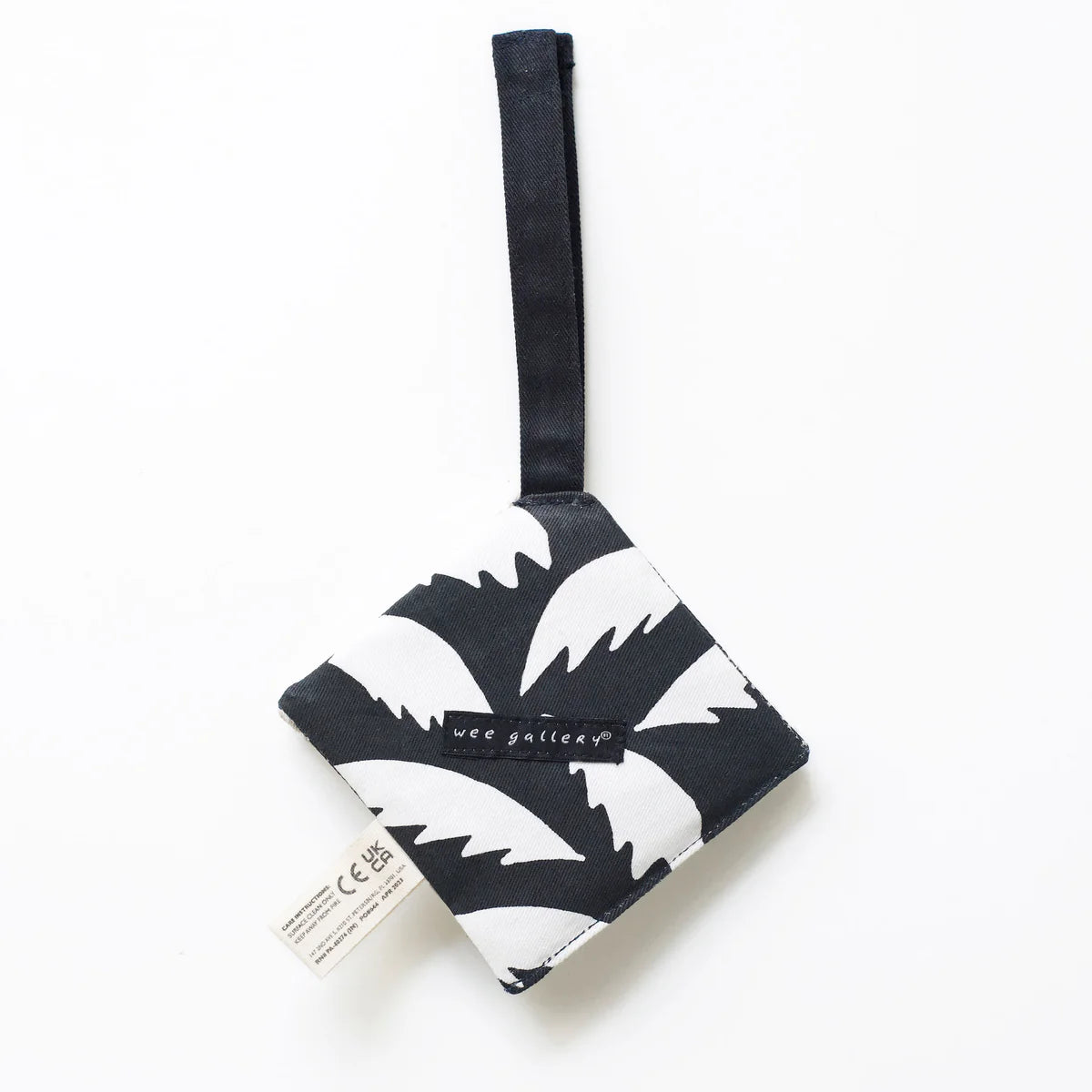 Black and white patterned pouch with a strap on a white background