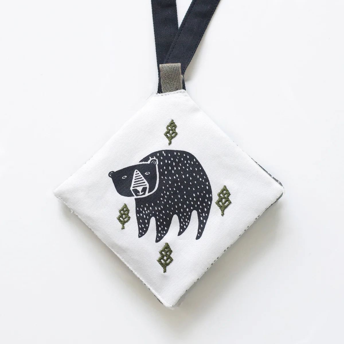 White pouch with a black bear illustration on a white background