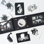 Black and white illustrated cards with animal designs on a white background